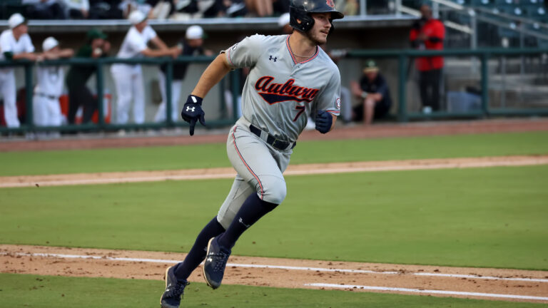 College World Series Monday Recap: Auburn Survives, Ole Miss Thrives
