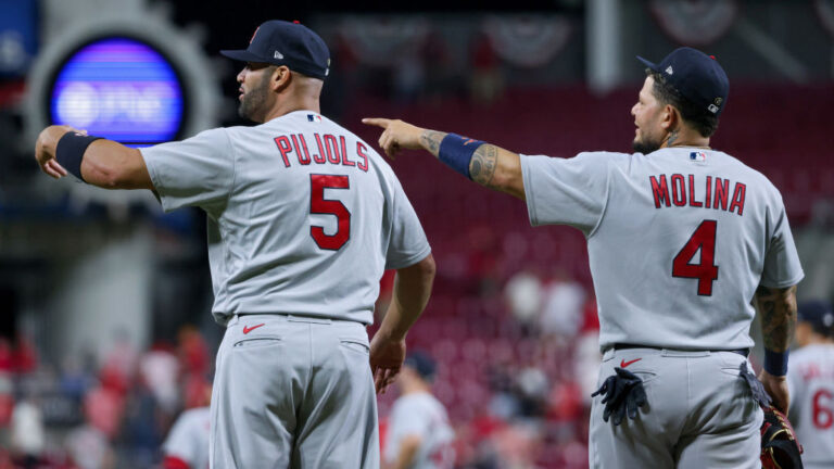 CINCINNATI, OHIO - APRIL 22: Albert Pujols #5 and Yadier Molina #4 of the St. Louis Cardinals celebrate after beating the Cincinnati Reds 4-2 at Great American Ball Park on April 22, 2022 in Cincinnati, Ohio. (Photo by Dylan Buell/Getty Images)