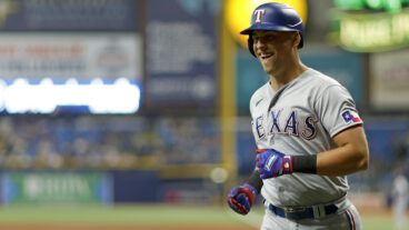 Nathaniel Lowe #30 of the Texas Rangers is congratulated after hitting a two run home run in the third inning.