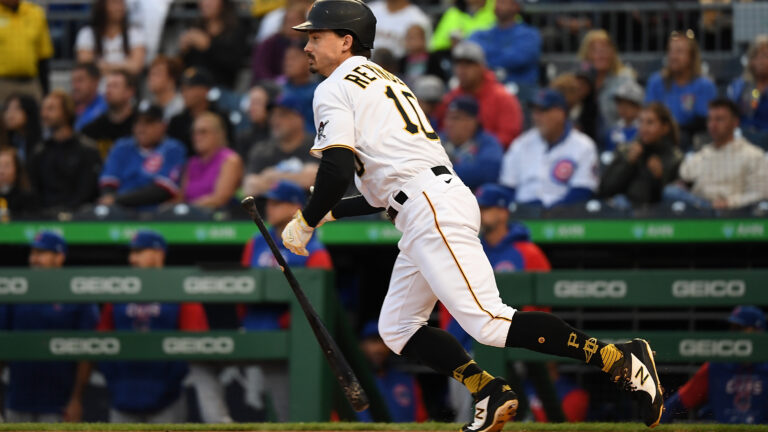 Bryan Reynolds #10 of the Pittsburgh Pirates hits an RBI single in the first inning during the game against the Chicago Cubs at PNC Park.