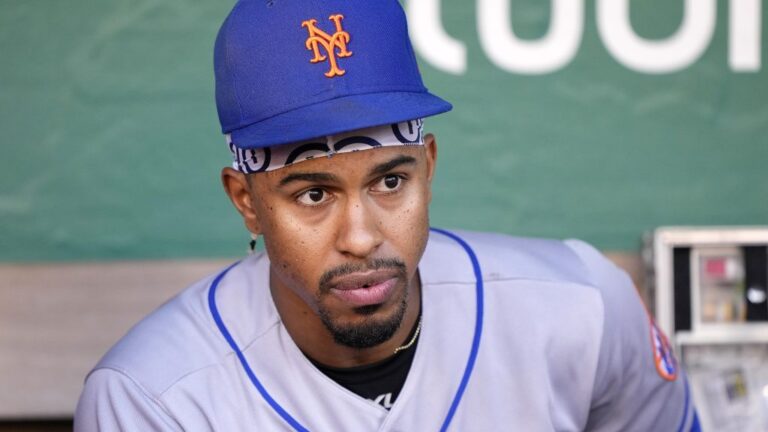 Francisco Lindor #12 of the New York Mets looks on from the dugout while preparing for his game against the Oakland Athletics at RingCentral Coliseum.