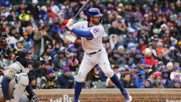 Dansby Swanson of the Chicago Cubs at bat against the Milwaukee Brewers during the ninth inning at Wrigley Field.