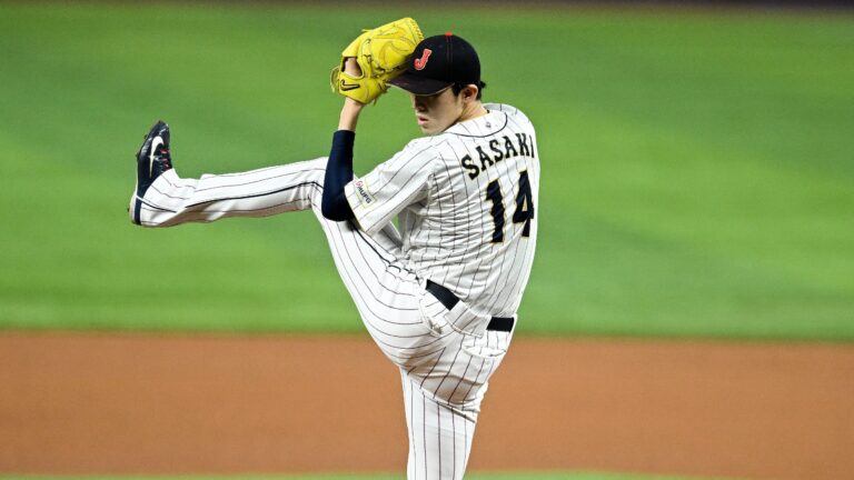 Roki Sasaki #14 of Team Japan pitches in the top of the first inning during the World Baseball Classic Semifinals between Mexico and Japan at loanDepot park.