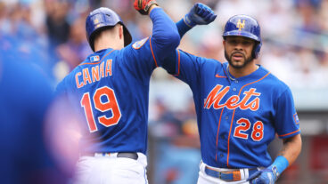 Tommy Pham #28 of the New York Mets celebrates with Mark Canha #19 after hitting a third inning home run at Citi Field.