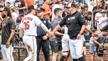 Baltimore Orioles manager Brandon Hyde (18) congratulates designated hitter Adley Rutschman (35) following the Houston Astros versus the Baltimore Orioles on August 10, 2023 at Oriole Park at Camden Yards.