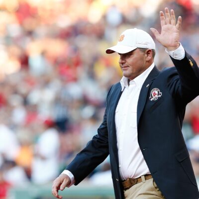 Former Boston Red Sox pitcher Roger Clemens walks on the field after being inducted into the Red Sox Hall of Fame before a game between the Red Sox and the Houston Astros at Fenway Park.