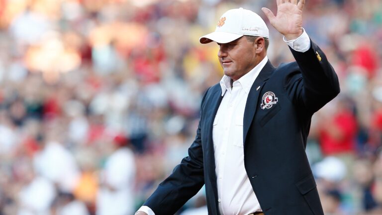 Former Boston Red Sox pitcher Roger Clemens walks on the field after being inducted into the Red Sox Hall of Fame before a game between the Red Sox and the Houston Astros at Fenway Park.