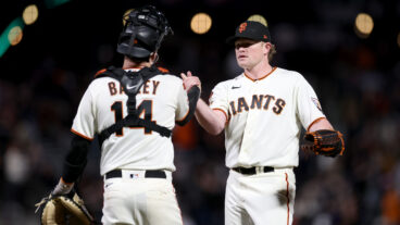 Logan Webb #62 shakes hands with Patrick Bailey #14 of the San Francisco Giants after they beat the San Diego Padres at Oracle Park.