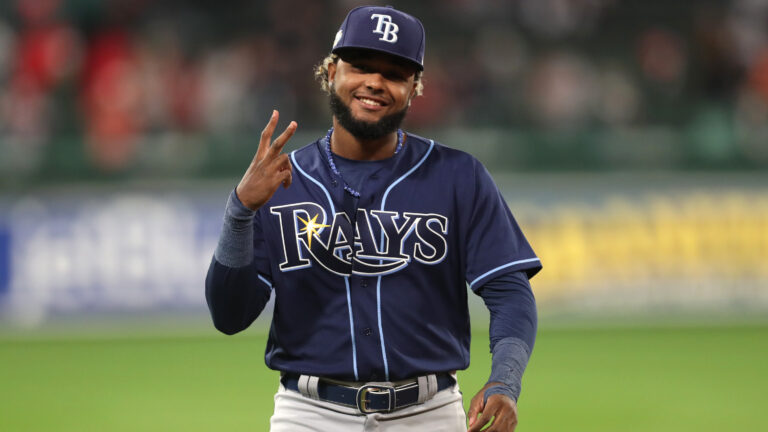 Junior Caminero of the Tampa Bay Rays warms up before playing against the Boston Red Sox at Fenway Park.