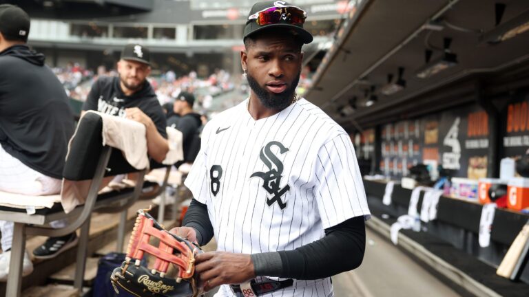 Chicago White Sox center fielder Luis Robert Jr. puts on his glove before a game against the St. Louis Cardinals on July 8, 2023, at Guaranteed Rate Field in Chicago.