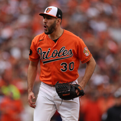 Grayson Rodriguez #30 of the Baltimore Orioles reacts against the Texas Rangers during Game Two of the American League Division Series at Oriole Park at Camden Yards.