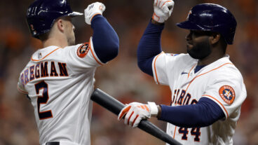 Alex Bregman #2 of the Houston Astros celebrates with Yordan Alvarez #44 after hitting a solo home run against Max Scherzer #31 of the Texas Rangers during the third inning in Game Seven of the American League Championship Series at Minute Maid Park on October 23, 2023 in Houston, Texas. (Photo by Carmen Mandato/Getty Images)