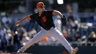 Jordan Hicks (12) of the San Francisco Giants throws live BP during the workout at Scottsdale Stadium.