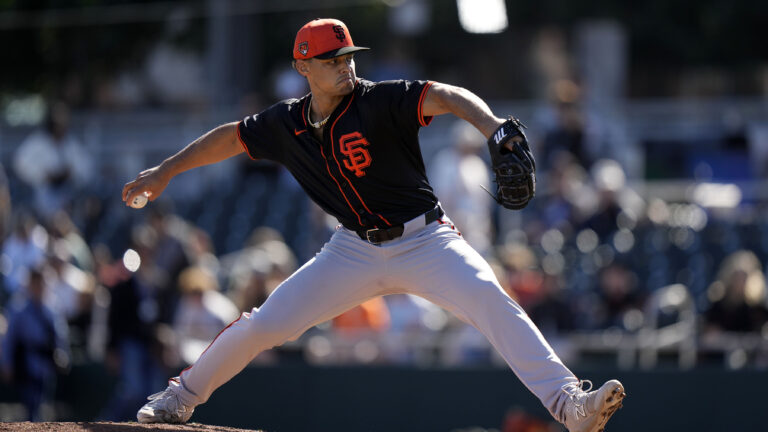 Jordan Hicks (12) of the San Francisco Giants throws live BP during the workout at Scottsdale Stadium.