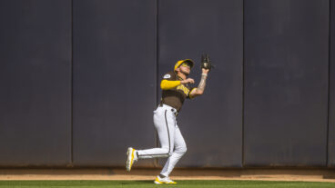 Jackson Merrill of the San Diego Padres makes a catch in center field during a Spring Training game against the Kansas City Royals at the Peoria Stadium.