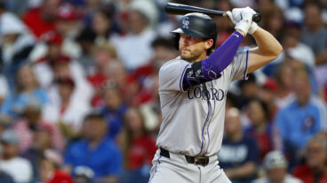Ryan McMahon of the Colorado Rockies in action against the Philadelphia Phillies at Citizens Bank Park on April 15, 2024 in Philadelphia, Pennsylvania. All players are wearing the number 42 in honor of Jackie Robinson Day.