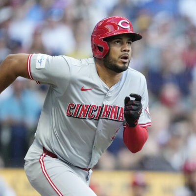 Jeimer Candelario of the Cincinnati Reds hits a double in the first inning against the Milwaukee Brewers at American Family Field.