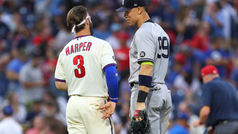 Bryce Harper of the Philadelphia Phillies talks with Aaron Judge of the New York Yankees during a game at Citizens Bank Park.