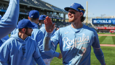 Kansas City Royals shortstop Bobby Witt Jr. gets high fives from teammates after an MLB game between the Houston Astros and Kansas City Royals at Kauffman Stadium. Both teams are in the AL playoff race.