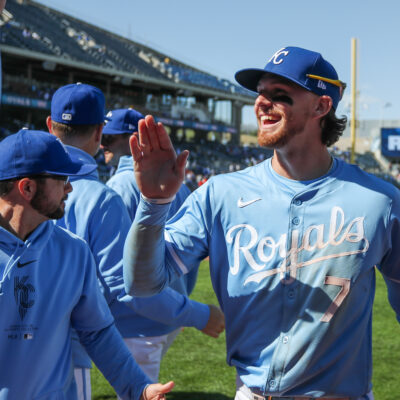 Kansas City Royals shortstop Bobby Witt Jr. gets high fives from teammates after an MLB game between the Houston Astros and Kansas City Royals at Kauffman Stadium. Both teams are in the AL playoff race.