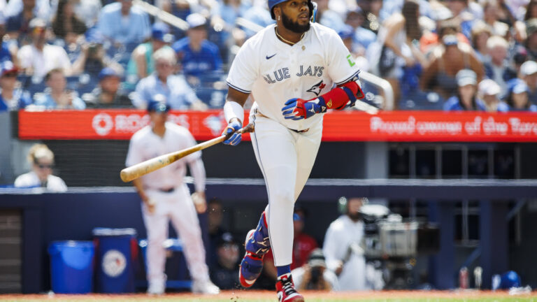 TORONTO, CANADA - JULY 20: Vladimir Guerrero Jr. #27 of the Toronto Blue Jays runs out a single in the first inning of their MLB game against the Detroit Tigers at Rogers Centre on July 20, 2024 in Toronto, Ontario, Canada. (Photo by Cole Burston/Getty Images)