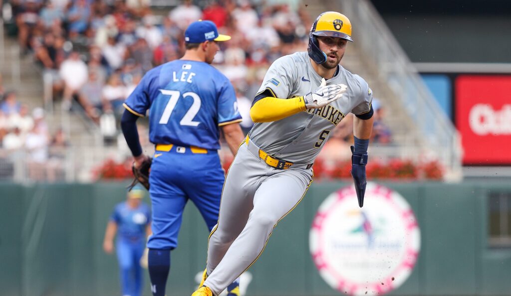 Garrett Mitchell of the Milwaukee Brewers rounds third base on a RBI single hit by Jackson Chourio during the third inning against the Minnesota Twins at Target Field.