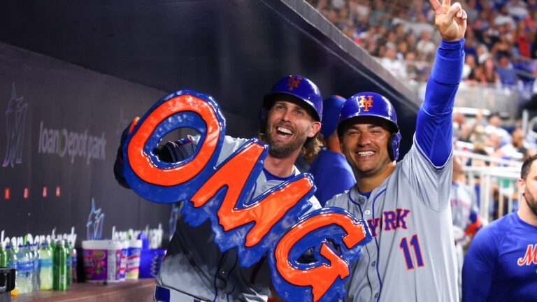 Jeff McNeil of the New York Mets celebrates with teammate Jose Iglesias after hitting a home run against the Miami Marlins during the sixth inning of the game at loanDepot Park.