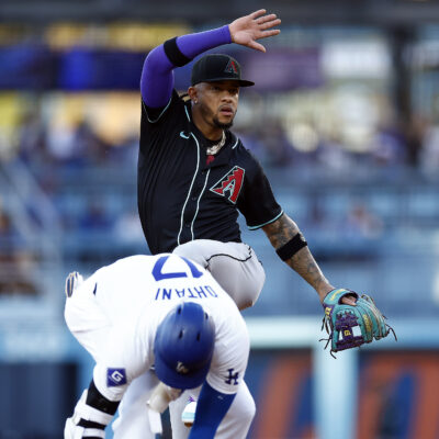 Ketel Marte of the Arizona Diamondbacks mimics the hit Los Angeles Dodgers double celebration in front of Shohei Ohtani in the first inning at Dodger Stadium.