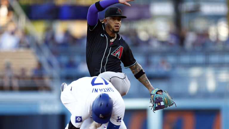 Ketel Marte of the Arizona Diamondbacks mimics the hit Los Angeles Dodgers double celebration in front of Shohei Ohtani in the first inning at Dodger Stadium.