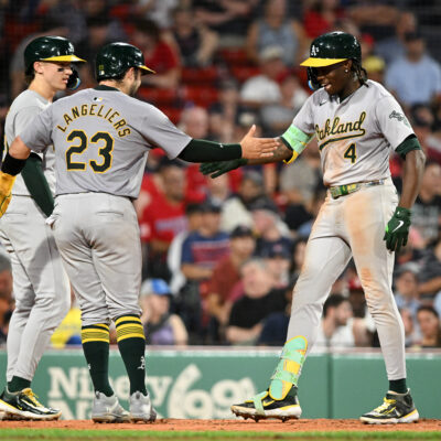 Breakout star Lawrence Butler of the Oakland Athletics celebrates with Shea Langeliers #23 and Zack Gelof #20 after hitting a three-run home run.