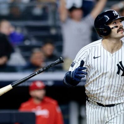 Austin Wells of the New York Yankees watches his two-run homerun in the bottom of the eighth inning during the game against the St. Louis Cardinals at Yankee Stadium.