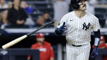 Austin Wells of the New York Yankees watches his two-run homerun in the bottom of the eighth inning during the game against the St. Louis Cardinals at Yankee Stadium.