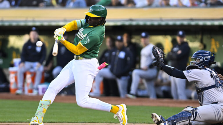 Oakland Athletics outfielder Lawrence Butler (4) hits a single during an MLB game between the New York Yankees and Oakland Athletics.