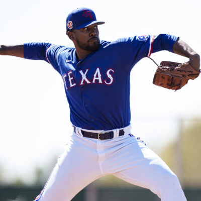Kumar Rocker of the Texas Rangers delivers a pitch during a spring training team workout at Surprise Stadium.