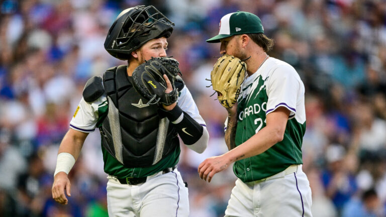 Kyle Freeland and catcher Hunter Goodman of the Colorado Rockies have a word after the top of the second inning.