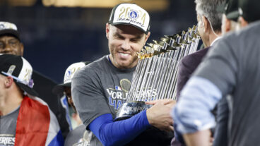 NEW YORK, NY - OCTOBER 30: Freddie Freeman #5 of the Los Angeles Dodgers celebrates with the Commissioner's Trophy after winning Game 5 of the 2024 World Series presented by Capital One between the Los Angeles Dodgers and the New York Yankees at Yankee Stadium on Wednesday, October 30, 2024 in New York, New York. The Los Angeles Dodgers won 7-6. (Photo by Rob Tringali/MLB Photos via Getty Images)