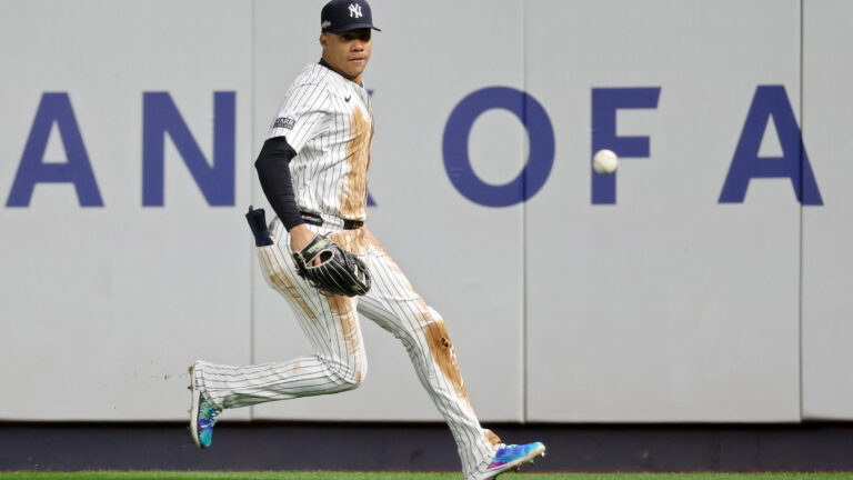 Juan Soto of the New York Yankees chases a ball hit by Josh Naylor #22 of the Cleveland Guardians for a single in the second inning during Game Two of the American League Championship Series at Yankee Stadium.
