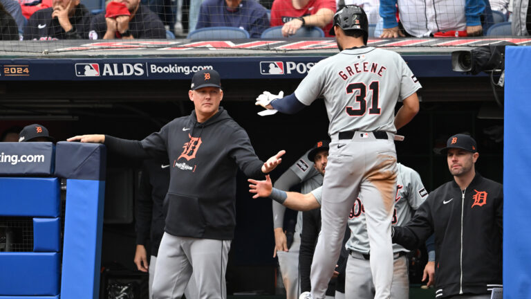CLEVELAND, OHIO - OCTOBER 12: Manager A.J. Hinch #14 of the Detroit Tigers greets Riley Greene #31 of the Detroit Tigers during the seventh inning against the Cleveland Guardians during Game Five of the Division Series at Progressive Field on October 12, 2024 in Cleveland, Ohio. (Photo by Nick Cammett/Getty Images)