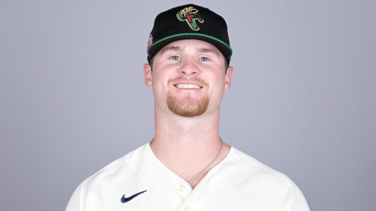 Rule 5 draft top pick Shane Smith, then of the Surprise Saguaros, poses for a photo during the Surprise Saguaros Photo Day at Scottsdale Stadium.