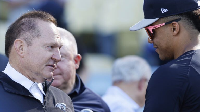 Sports agent Scott Boras talks to Juan Soto #22 of the New York Yankees during batting practice ahead of Game One of the 2024 World Series at Dodger Stadium.