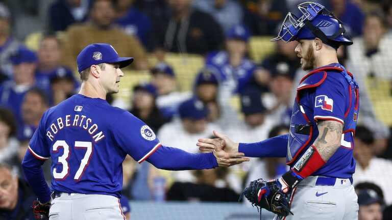 Free agent reliever David Robertson (then of the Texas Rangers) and Jonah Heim the third out against the Los Angeles Dodgers in the eighth inning at Dodger Stadium.