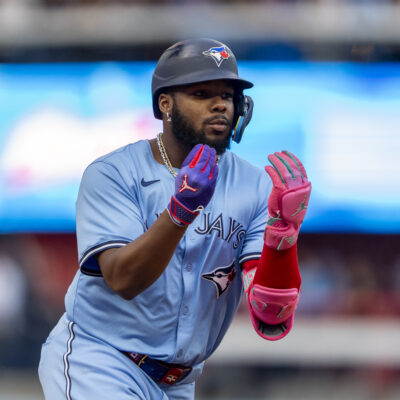 TORONTO, CANADA - AUGUST 19: Vladimir Guerrero Jr. #27 of the Toronto Blue Jays celebrates after hitting a home run against the Cincinnati Reds during the first inning in their MLB game at Rogers Centre on August 19, 2024 in Toronto, Canada. (Photo by Kevin Sousa/Getty Images)