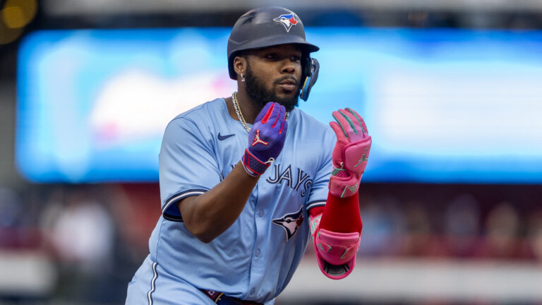 TORONTO, CANADA - AUGUST 19: Vladimir Guerrero Jr. #27 of the Toronto Blue Jays celebrates after hitting a home run against the Cincinnati Reds during the first inning in their MLB game at Rogers Centre on August 19, 2024 in Toronto, Canada. (Photo by Kevin Sousa/Getty Images)