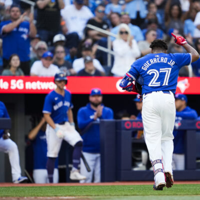 TORONTO, ON - SEPTEMBER 29: Vladimir Guerrero Jr. #27 of the Toronto Blue Jays salutes the crowd while coming out of the game after drawing a walk for his last at bat of the season, against the Miami Marlins, in their MLB game at the Rogers Centre on September 29, 2024 in Toronto, Ontario, Canada. (Photo by Mark Blinch/Getty Images)