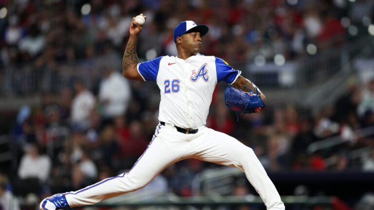 Raisel Iglesias of the Atlanta Braves delivers a pitch during the ninth inning against the Kansas City Royals at Truist Park.
