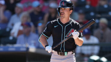 Corbin Carroll of the Arizona Diamondbacks bats against the Texas Rangers during the first inning of the MLB game at Surprise Stadium.