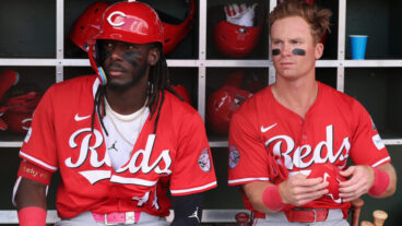 SURPRISE, ARIZONA - MARCH 12: Elly De La Cruz #44 and Matt McLain #9 of the Cincinnati Reds prepare to bat against the Texas Rangers during the first inning of the MLB game at Surprise Stadium on March 12, 2025 in Surprise, Arizona. (Photo by Christian Petersen/Getty Images)