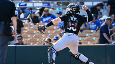 Edgar Quero of the Chicago White Sox warms up during the seventh inning of a spring training game against the Los Angeles Dodgers at Camelback Ranch.