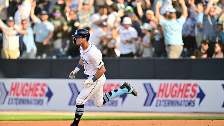 Kameron Misner of the Tampa Bay Rays rounds the bases after hitting a walk-off home run in the ninth inning to defeat the Colorado Rockies 3-2 in the MLB home opener at George M. Steinbrenner Field.