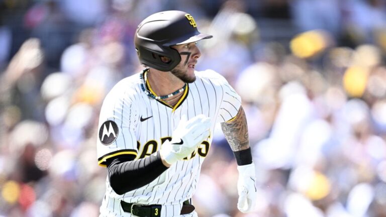 Jackson Merrill of the San Diego Padres hits a single in the first inning against the Atlanta Braves on Opening Day at Petco Park.